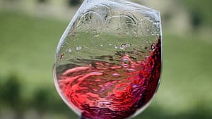 Swirling glass of De Bortoli red wine
