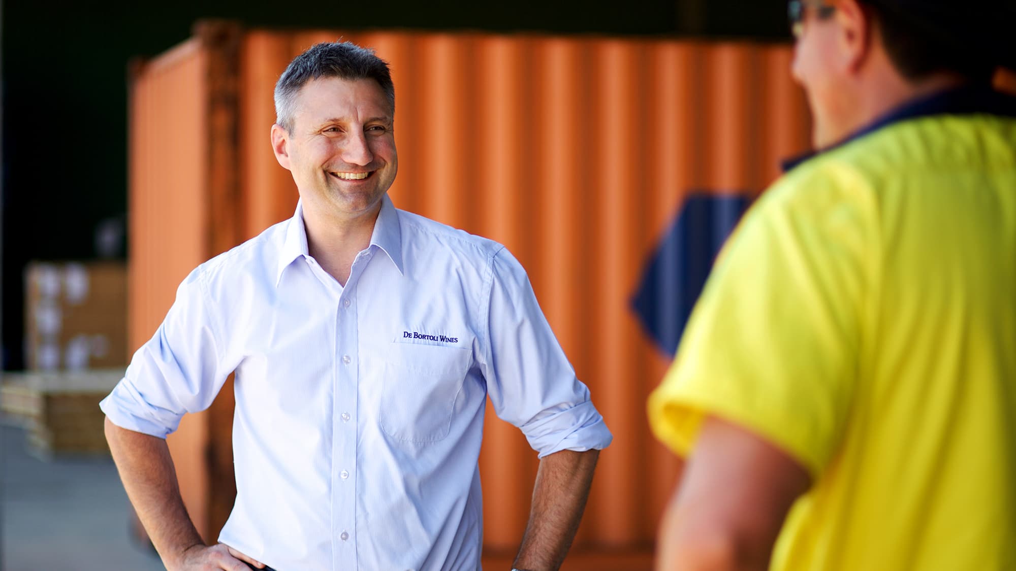 Victor De Bortoli, Export Manager for De Bortoli Wines, talking to staff, Bilbul winery