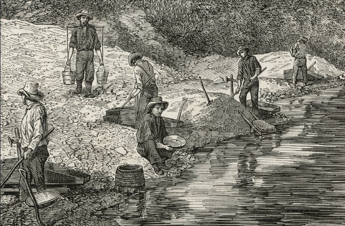 Woodcut of gold miners on river bank
