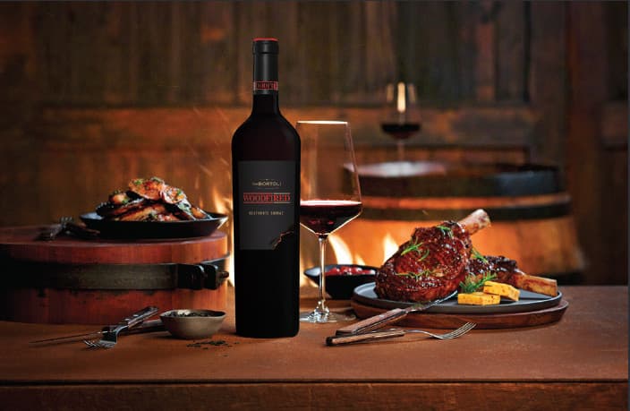 Table with food and Woodfired bottle